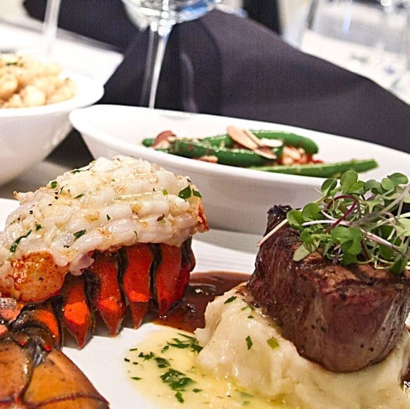 Table 13 lobster tail with steak and potatoes